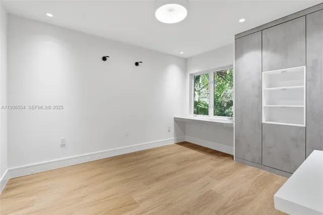 a bathroom with a toilet a sink and a window