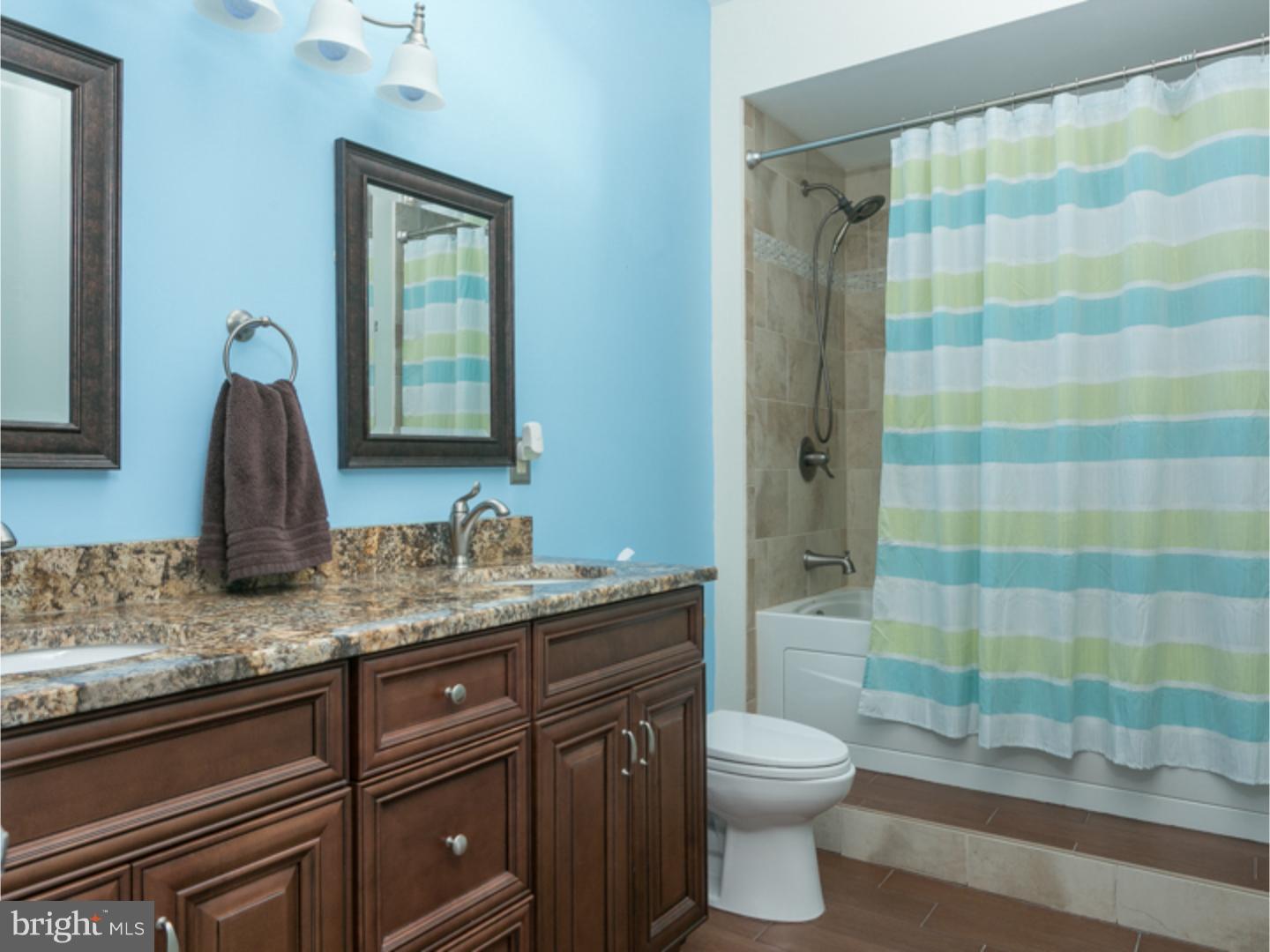 7 Baggaley Road Hamilton Square, NJ 08690 - Photo 21 of 24 a bathroom with a granite countertop sink a toilet and shower
