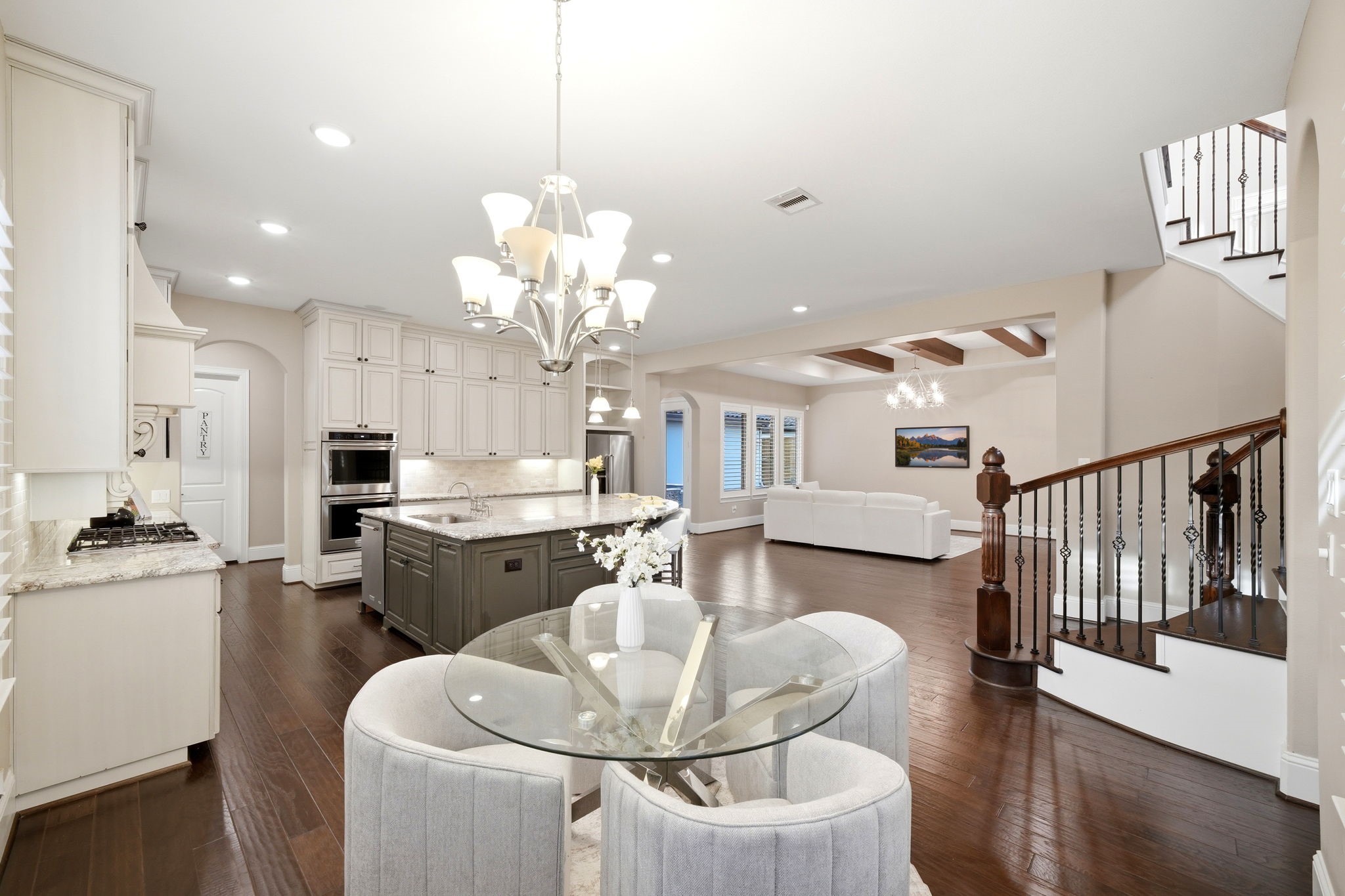 5815 Stratton Woods Drive Spring, TX 77389 - Photo 21 of 45 a dining room with wooden floor a chandelier a wooden table and chairs