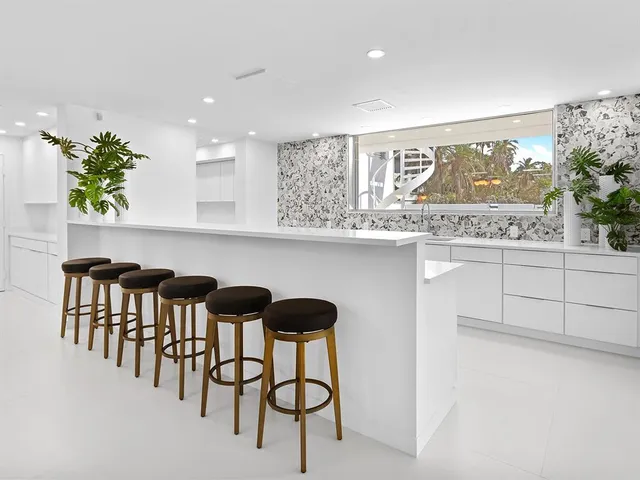 a bedroom with a bed and a large mirror