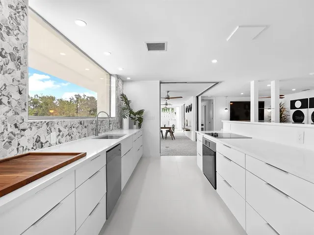 a bedroom with a bed and ceiling fan