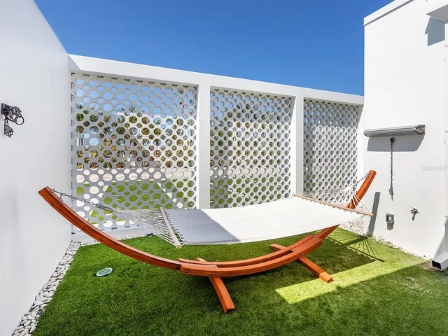 a view of a terrace with furniture and a table