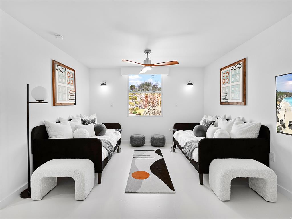 7647 Sanderling Road Sarasota, FL 34242 - Photo 42 of 75 a living room with furniture and a table