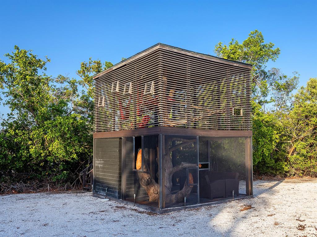 7647 Sanderling Road Sarasota, FL 34242 - Photo 57 of 75 a front view of a house