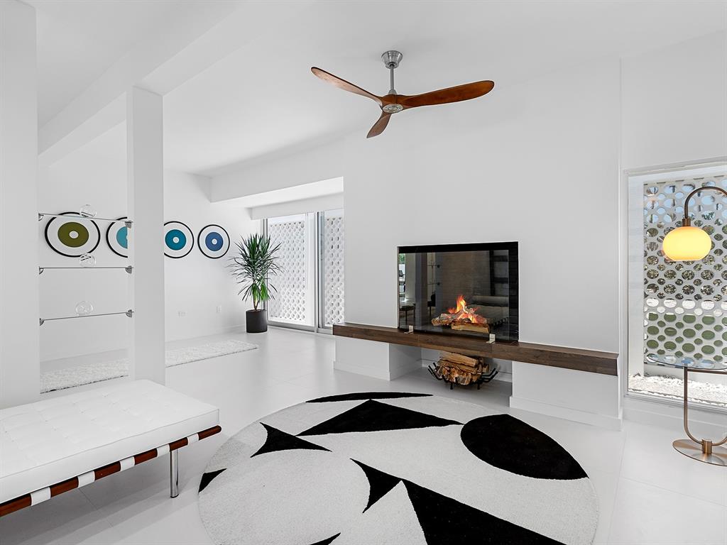 7647 Sanderling Road Sarasota, FL 34242 - Photo 9 of 75 a living room with furniture and a flat screen tv