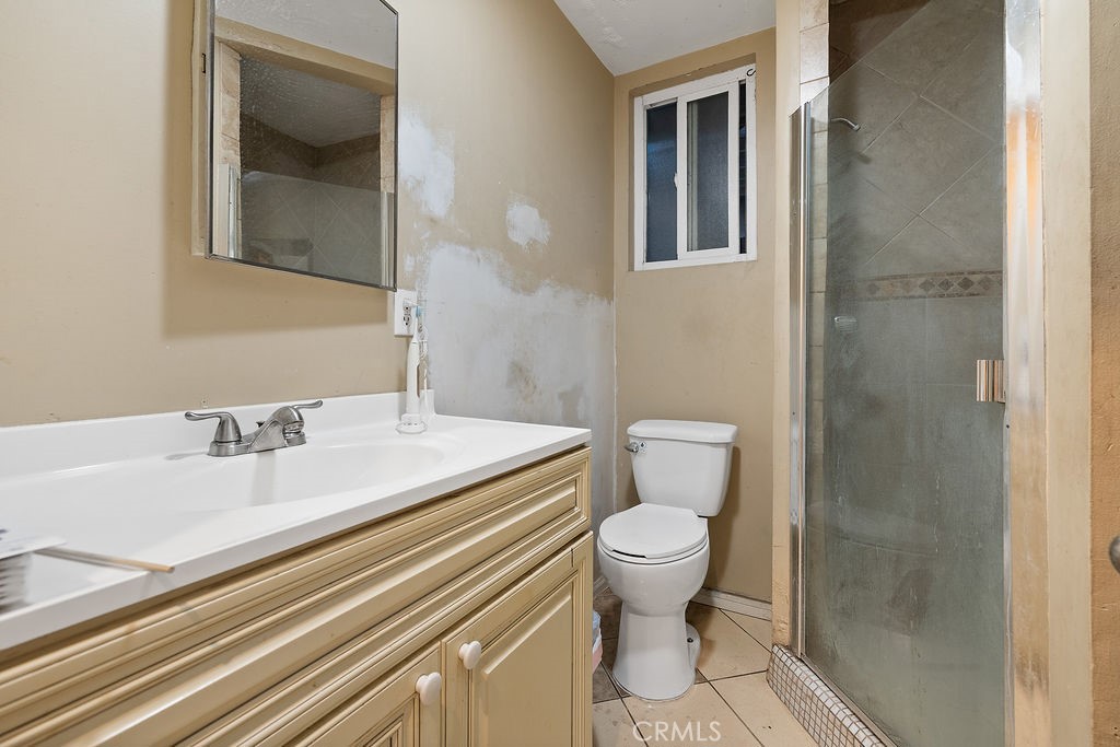 11633 Rincon Avenue Sylmar, CA 91342 - Photo 13 of 16 a bathroom with a sink and a mirror