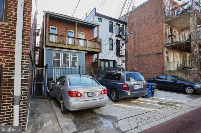 a view of a car park in front of a building