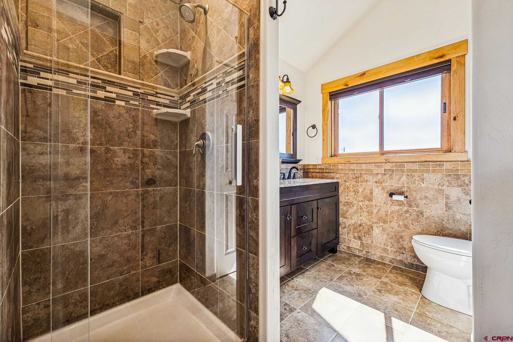 64 Summer Lane Durango, CO 81303 - Photo 13 of 25 a bathroom with a toilet and a shower