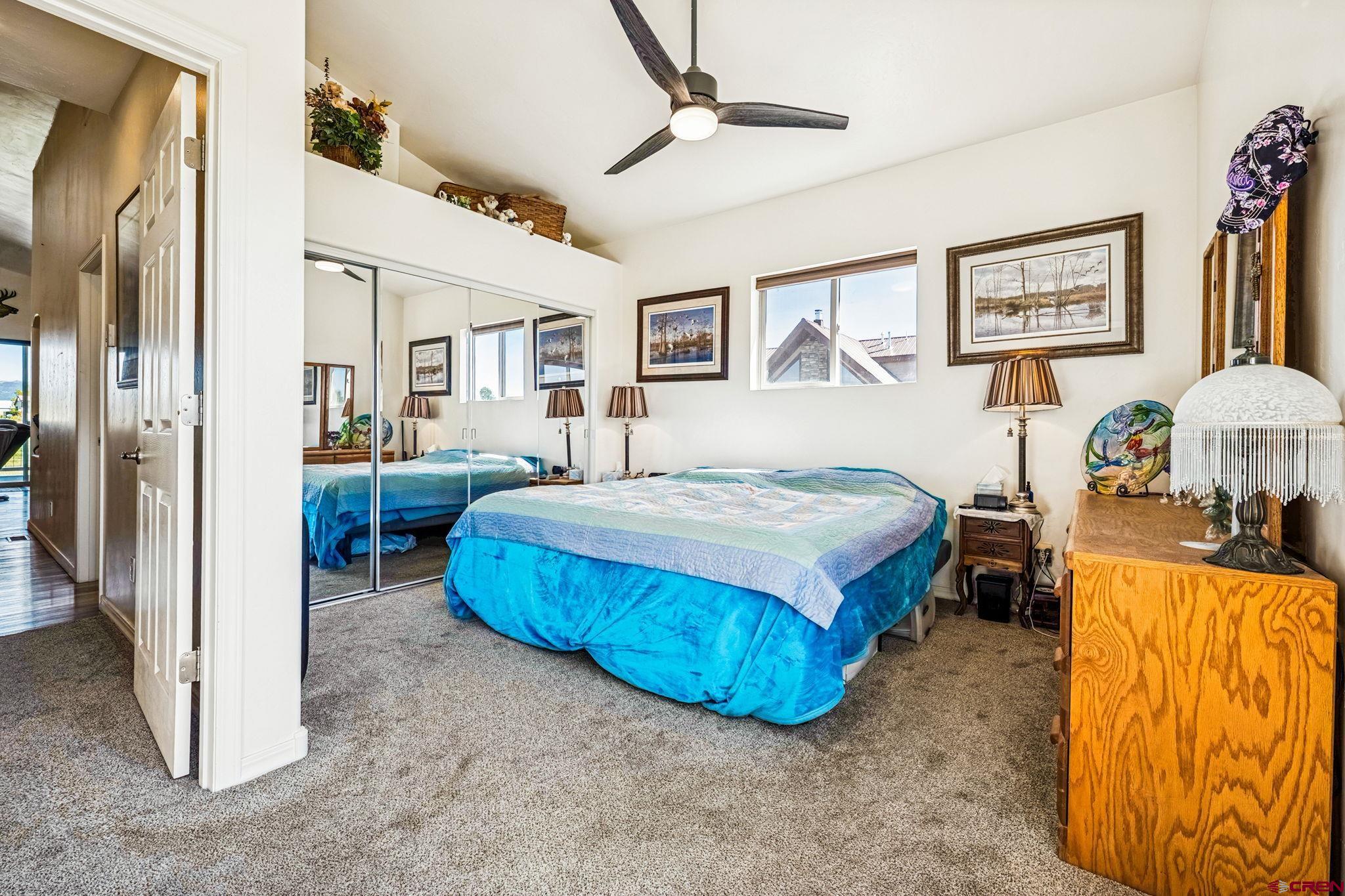 64 Summer Lane Durango, CO 81303 - Photo 21 of 25 a spacious bedroom with a bed and a table