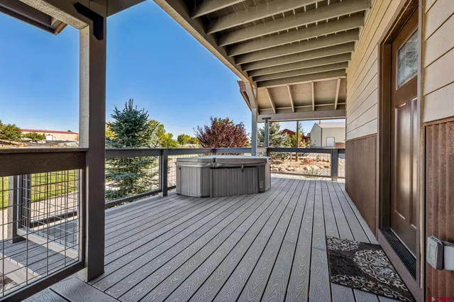 a view of a balcony with wooden floor