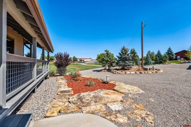 a view of a pathway with a yard