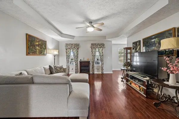 a living room with furniture and a fireplace