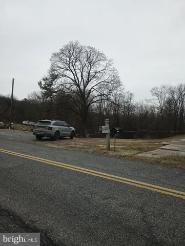 a view of street with parked cars