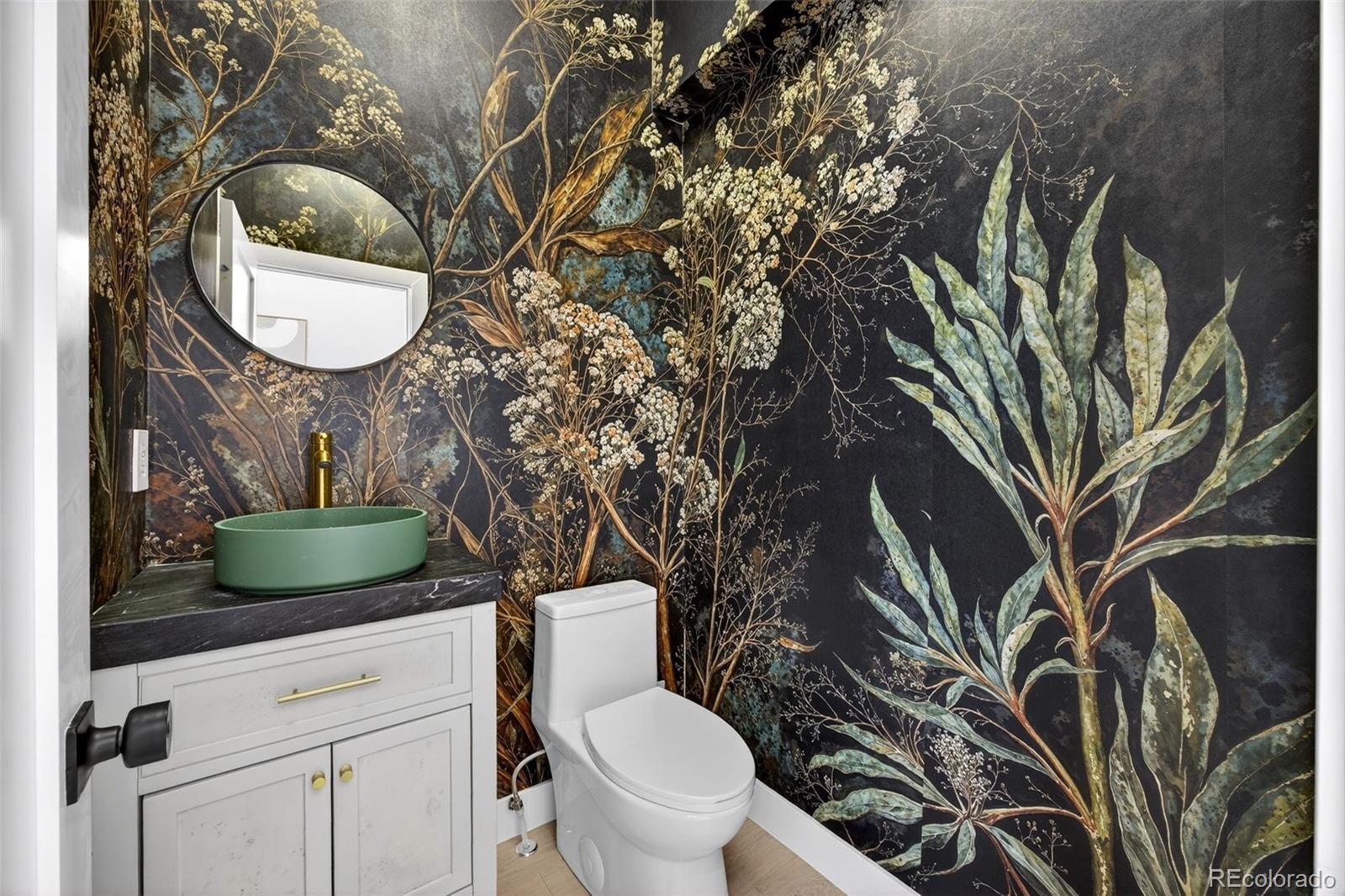5175 Raleigh Street Denver, CO 80212 - Photo 5 of 49 a bathroom with a toilet and a sink