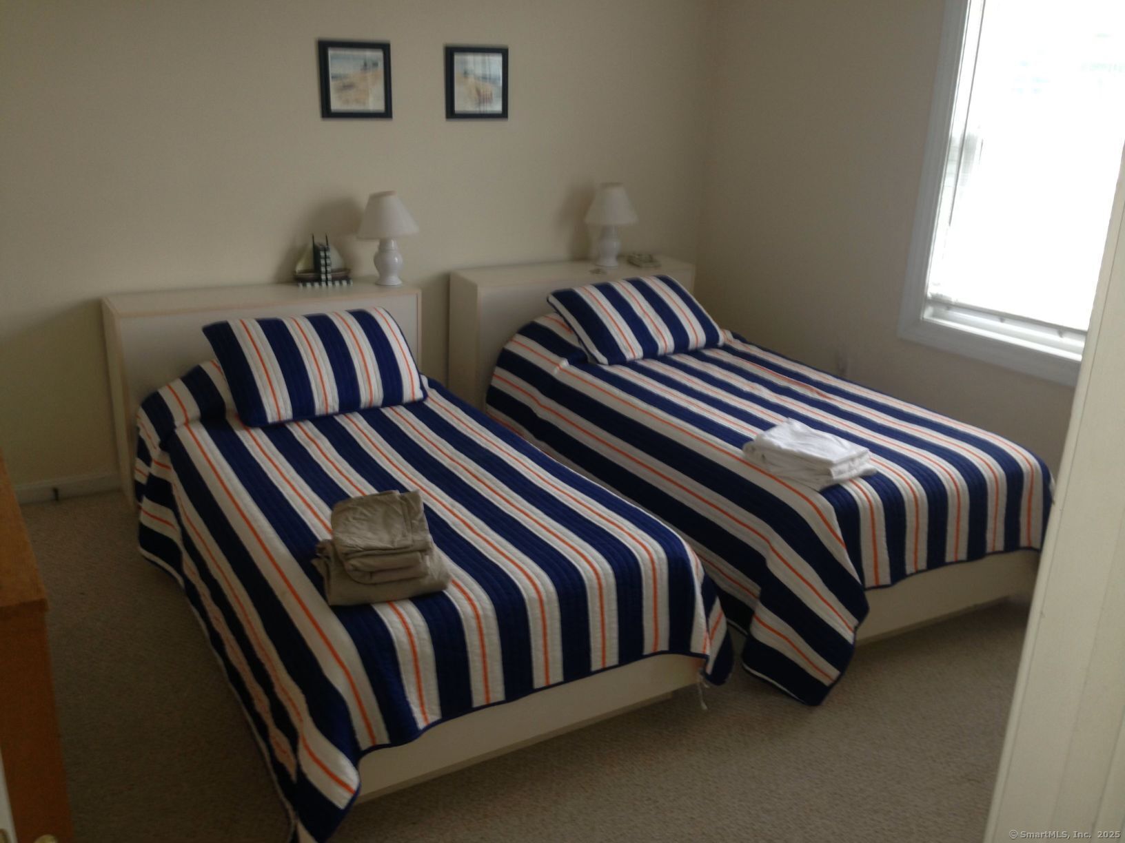 21 Atlantic Avenue Groton, CT 06340 - Photo 13 of 14 a bedroom with a bed and a window