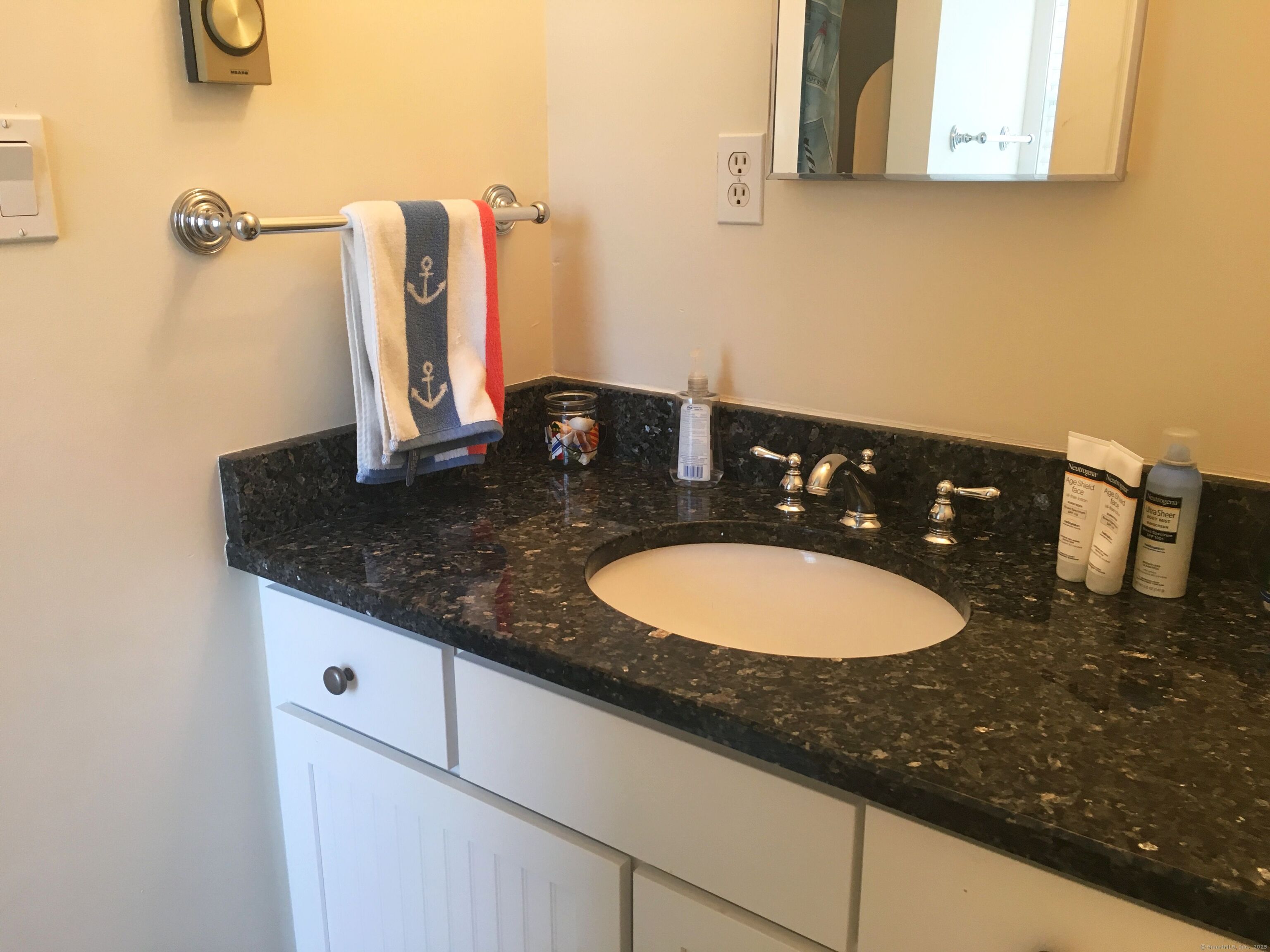 21 Atlantic Avenue Groton, CT 06340 - Photo 5 of 14 a bathroom with a granite countertop sink and a mirror