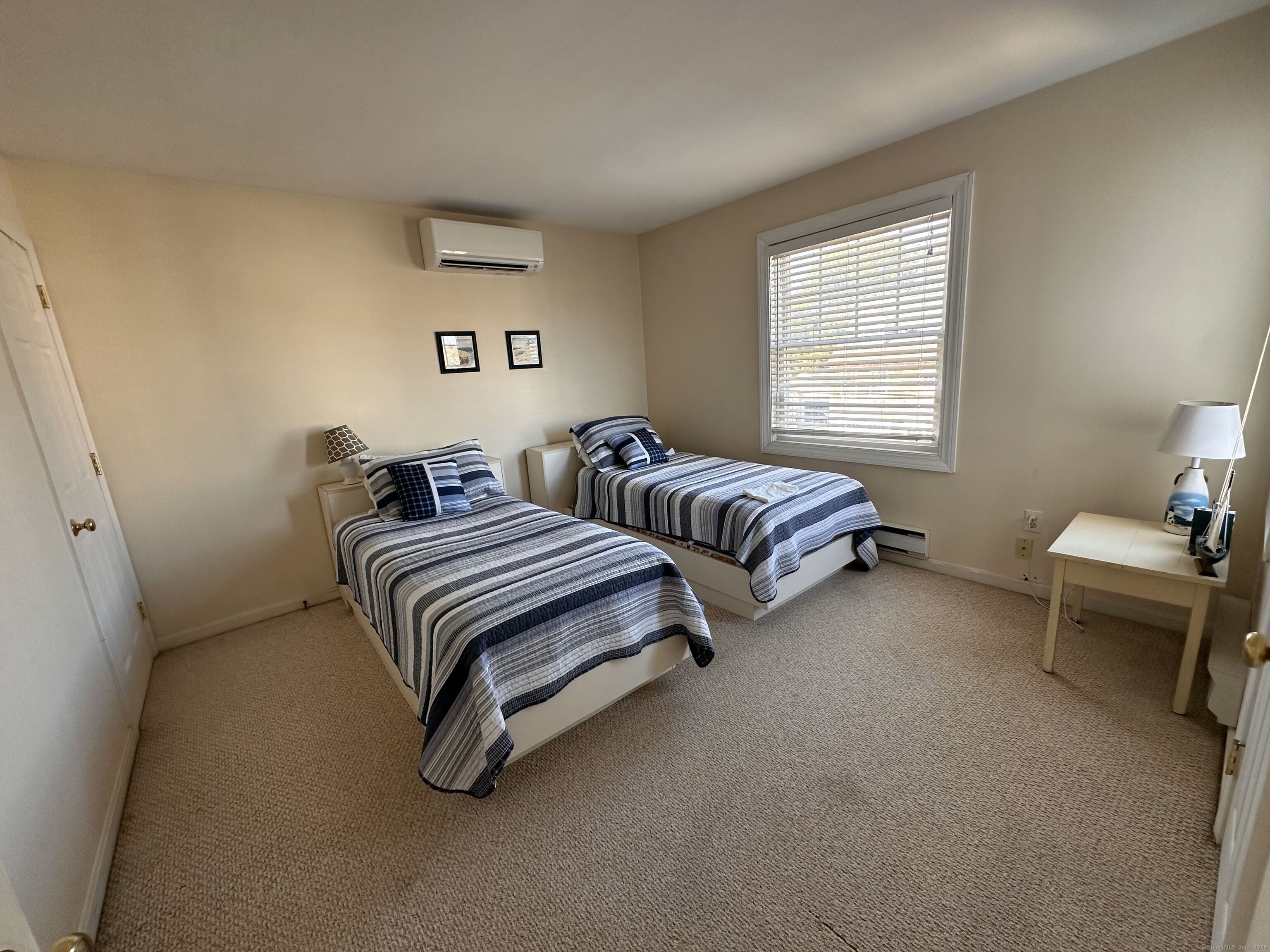 21 Atlantic Avenue Groton, CT 06340 - Photo 6 of 14 a bedroom with two beds and a couch