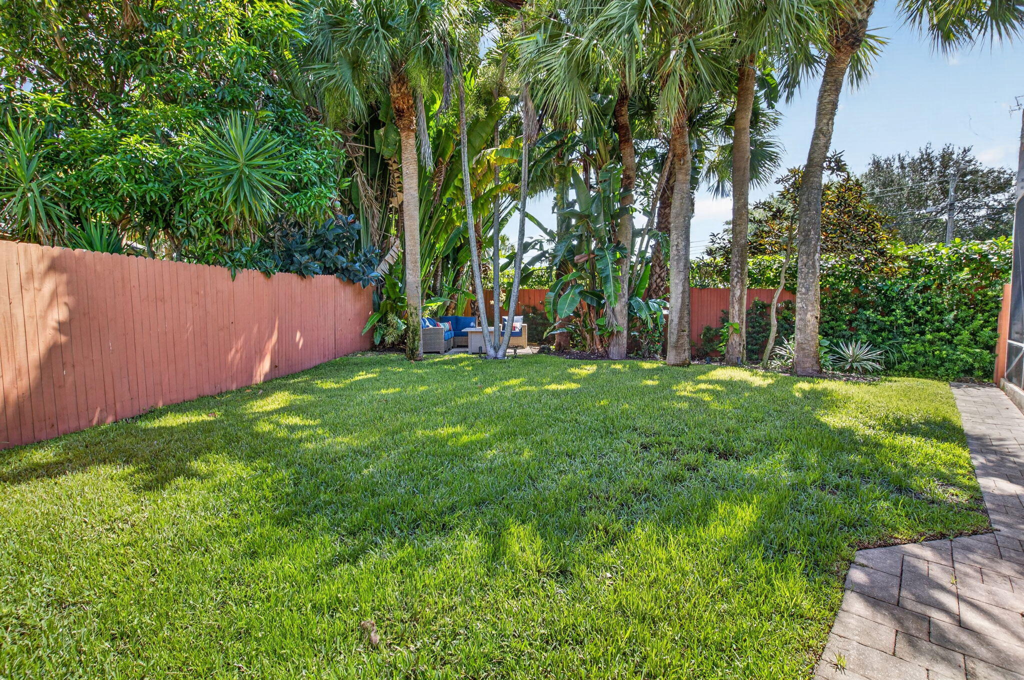 1365 East Barwick Ranch Circle Delray Beach, FL 33445 - Photo 62 of 77 a view of a backyard with palm trees