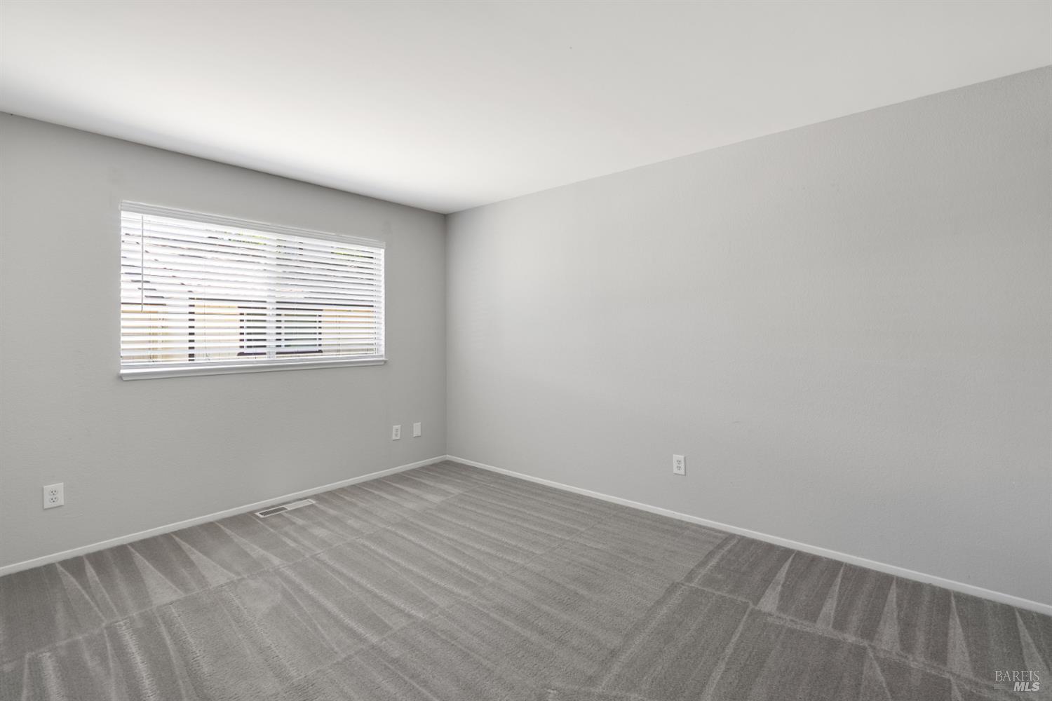 735 Blair Place Santa Rosa, CA 95401 - Photo 15 of 16 wooden floor in an empty room with a window