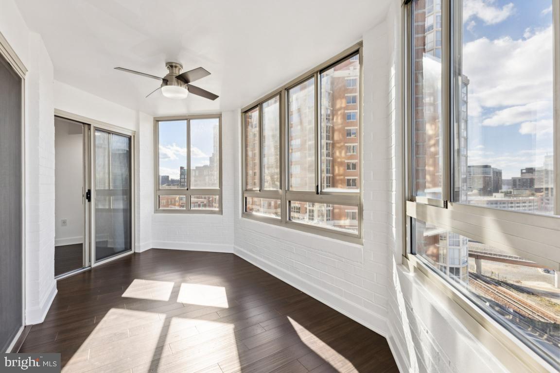 2151 Jamieson Avenue, Unit 1002 Alexandria, VA 22314 - Photo 12 of 25 a view of a room with wooden floor and windows