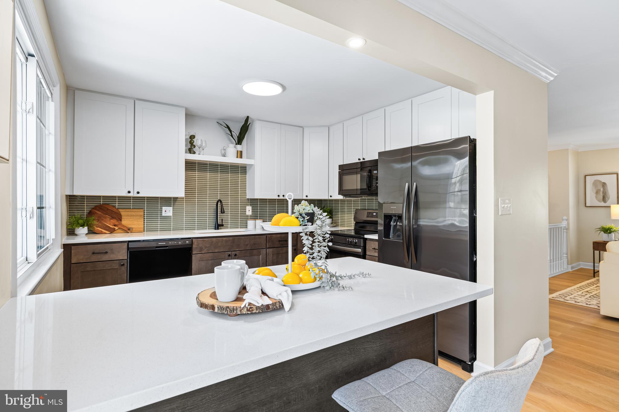 10845 Sandringham Road Cockeysville, MD 21030 - Photo 14 of 47 a kitchen with stainless steel appliances a dining table and chairs