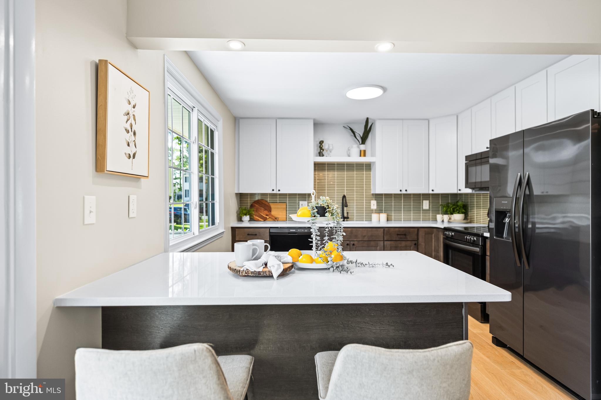 10845 Sandringham Road Cockeysville, MD 21030 - Photo 15 of 47 a kitchen with a table chairs refrigerator and cabinets