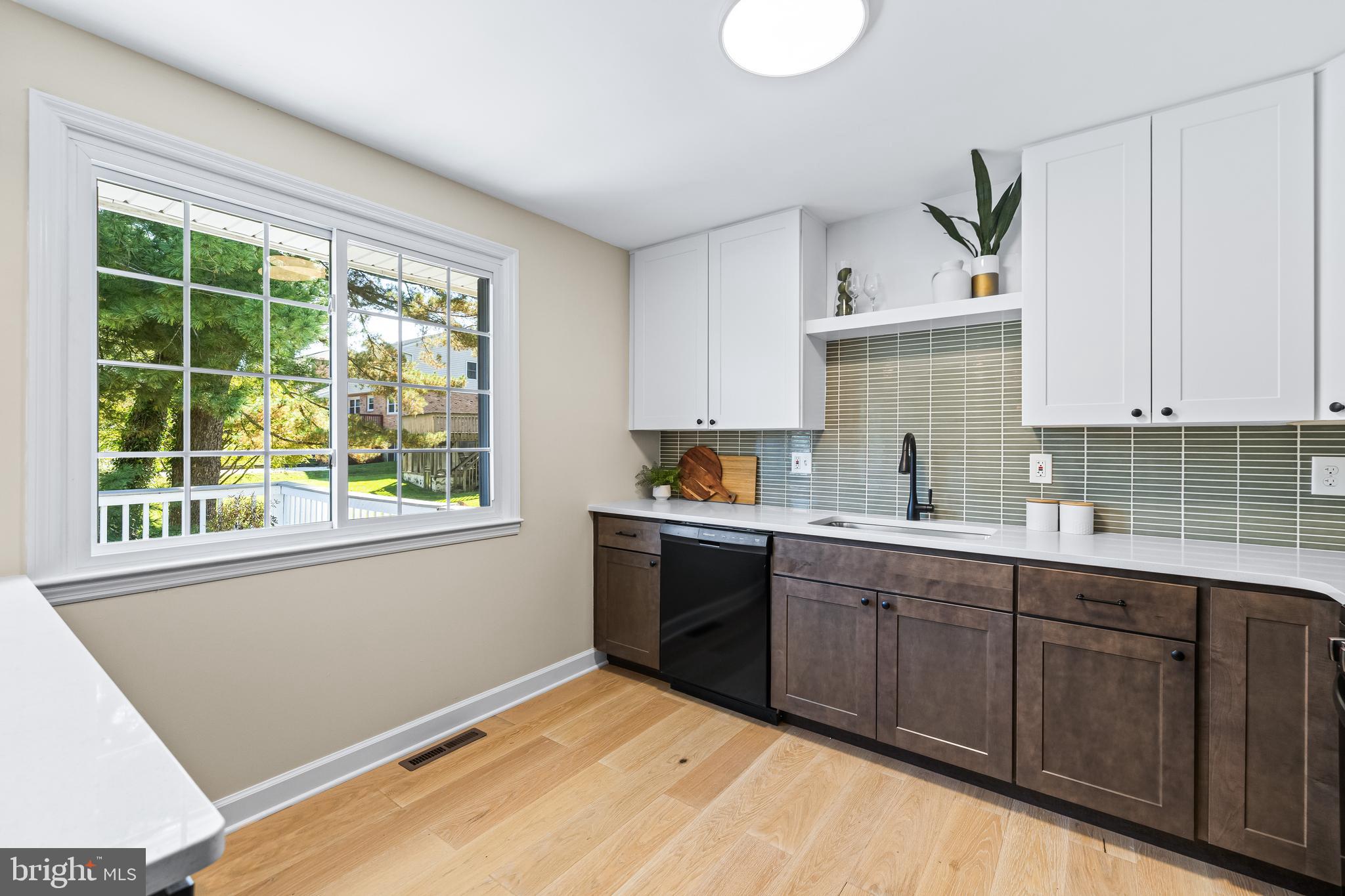 10845 Sandringham Road Cockeysville, MD 21030 - Photo 17 of 47 a kitchen with a sink cabinets and window