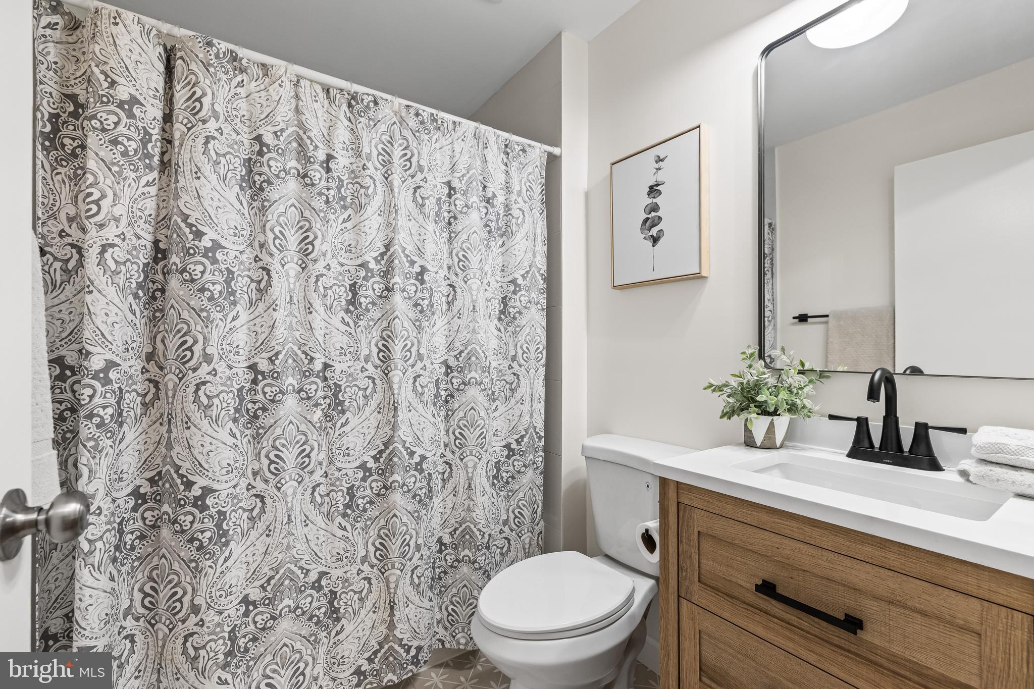 10845 Sandringham Road Cockeysville, MD 21030 - Photo 22 of 47 a bathroom with a granite countertop toilet sink and mirror