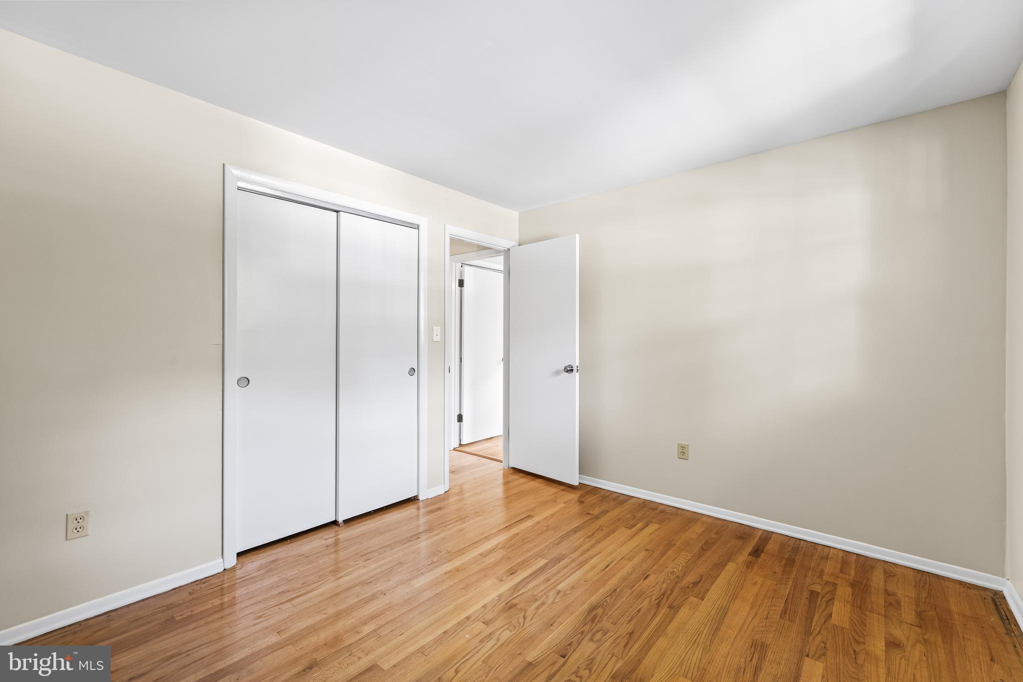 10845 Sandringham Road Cockeysville, MD 21030 - Photo 24 of 47 a view of an empty room with wooden floor