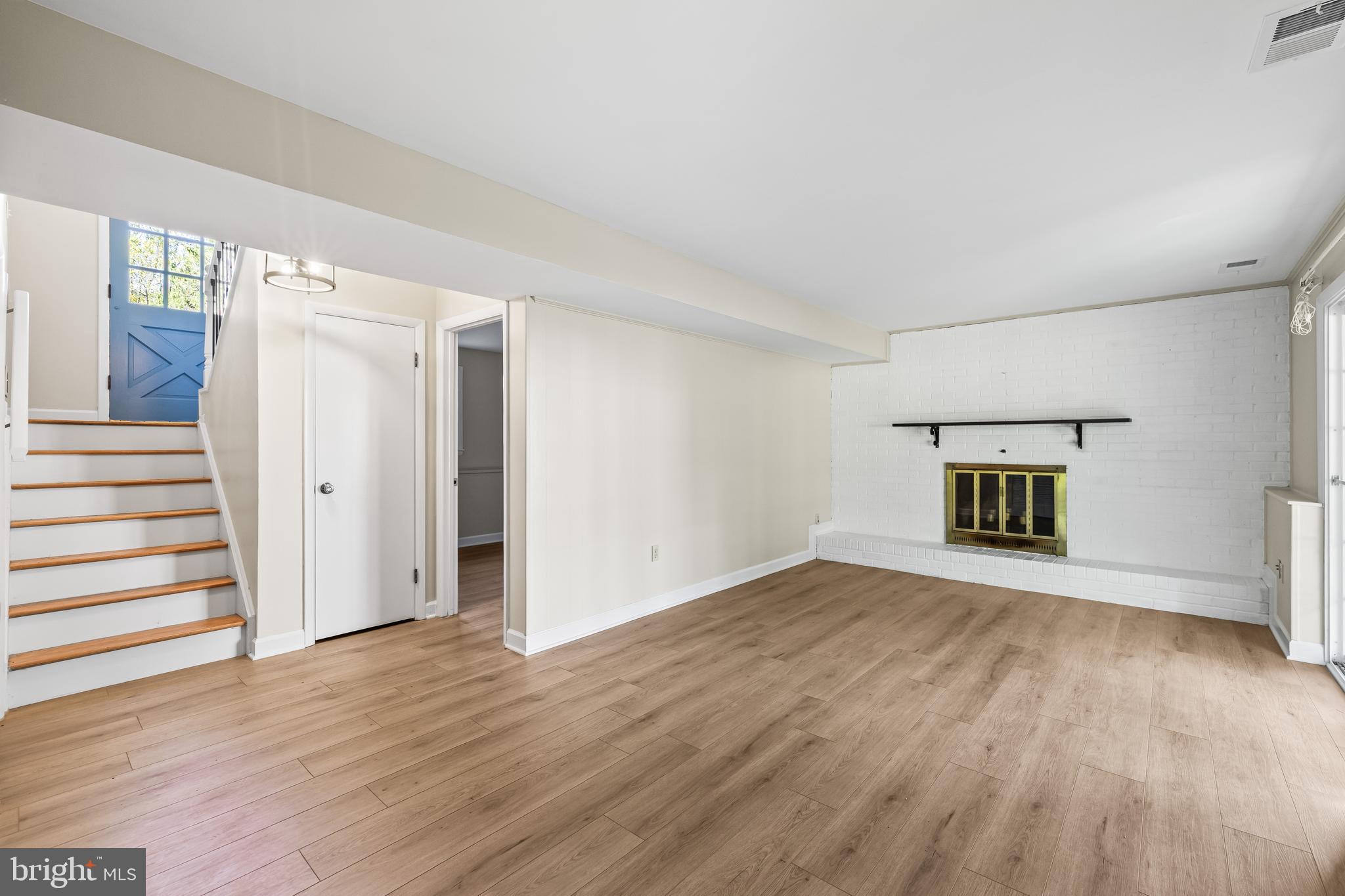 10845 Sandringham Road Cockeysville, MD 21030 - Photo 34 of 47 a view of an empty room with wooden floor and a window