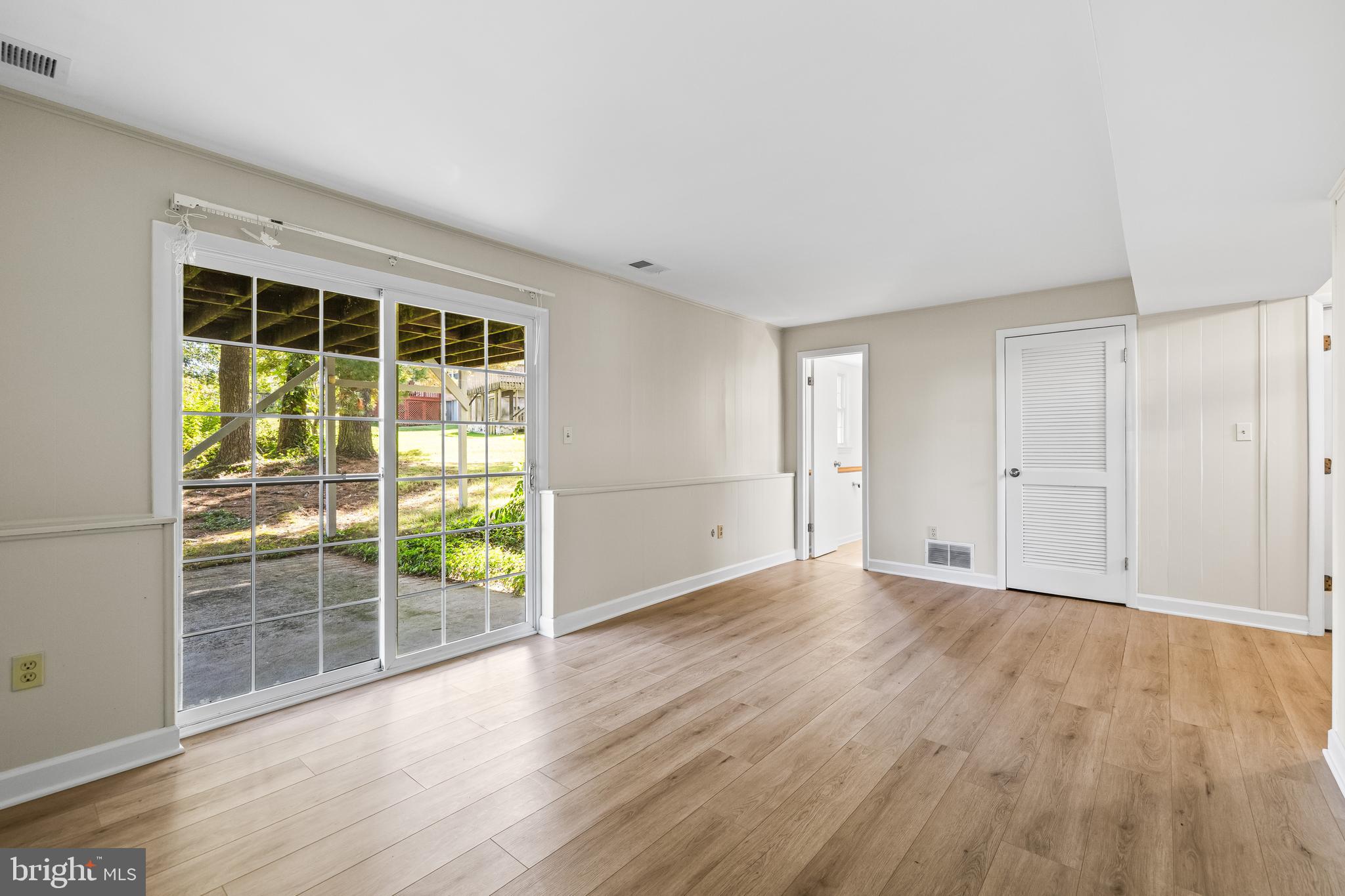 10845 Sandringham Road Cockeysville, MD 21030 - Photo 35 of 47 a view of an empty room with wooden floor and a window