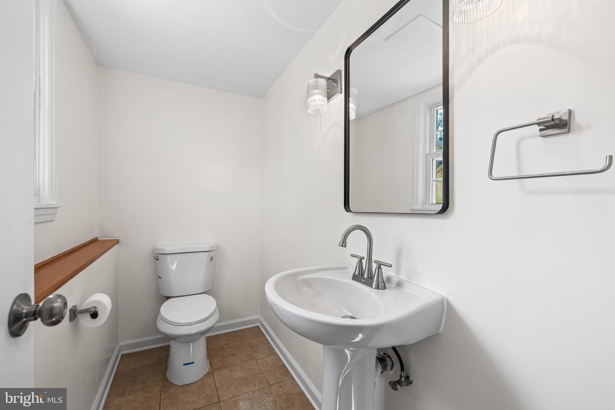 10845 Sandringham Road Cockeysville, MD 21030 - Photo 37 of 47 a bathroom with a sink toilet and mirror