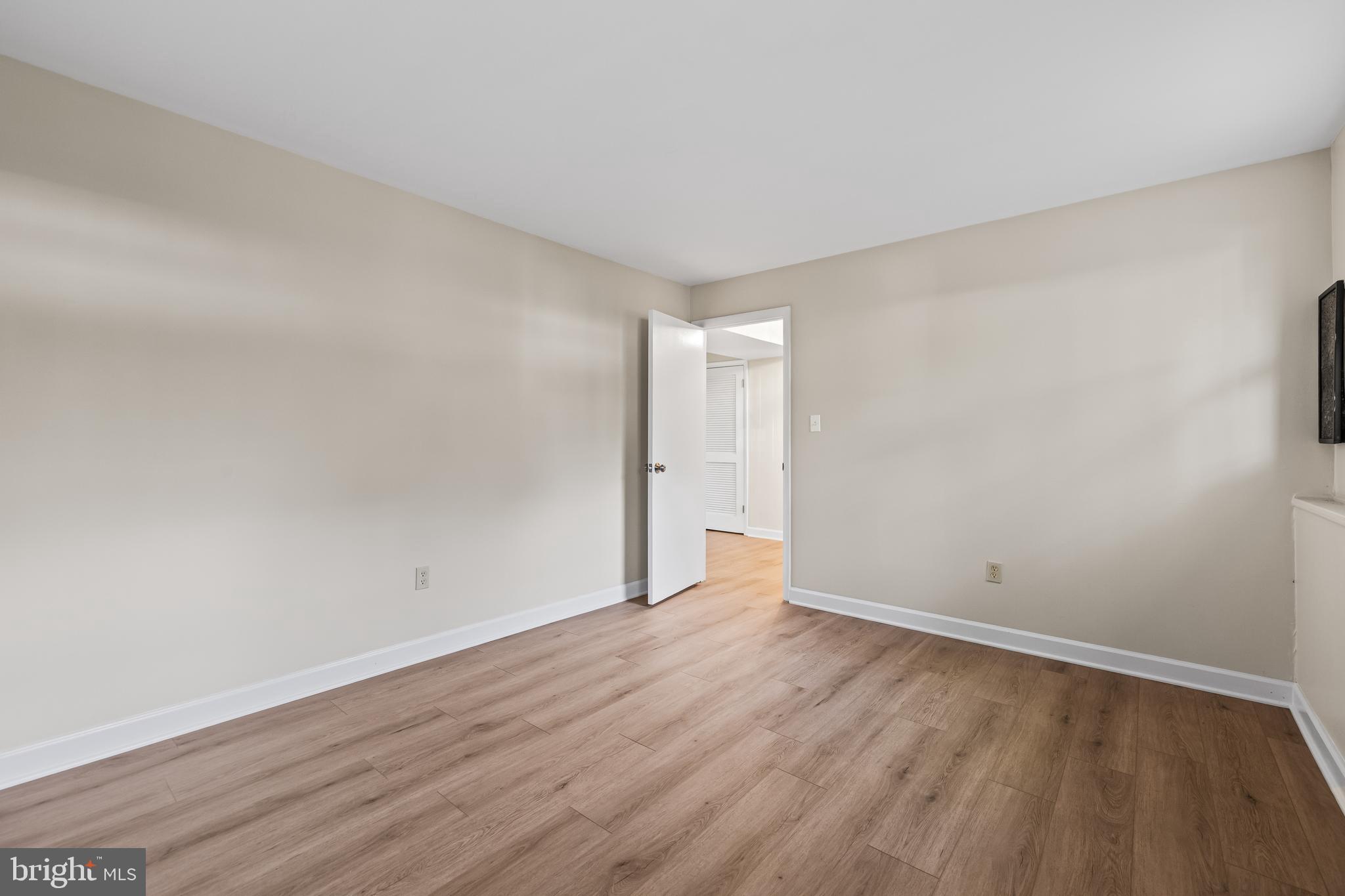 10845 Sandringham Road Cockeysville, MD 21030 - Photo 39 of 47 a view of an empty room with wooden floor