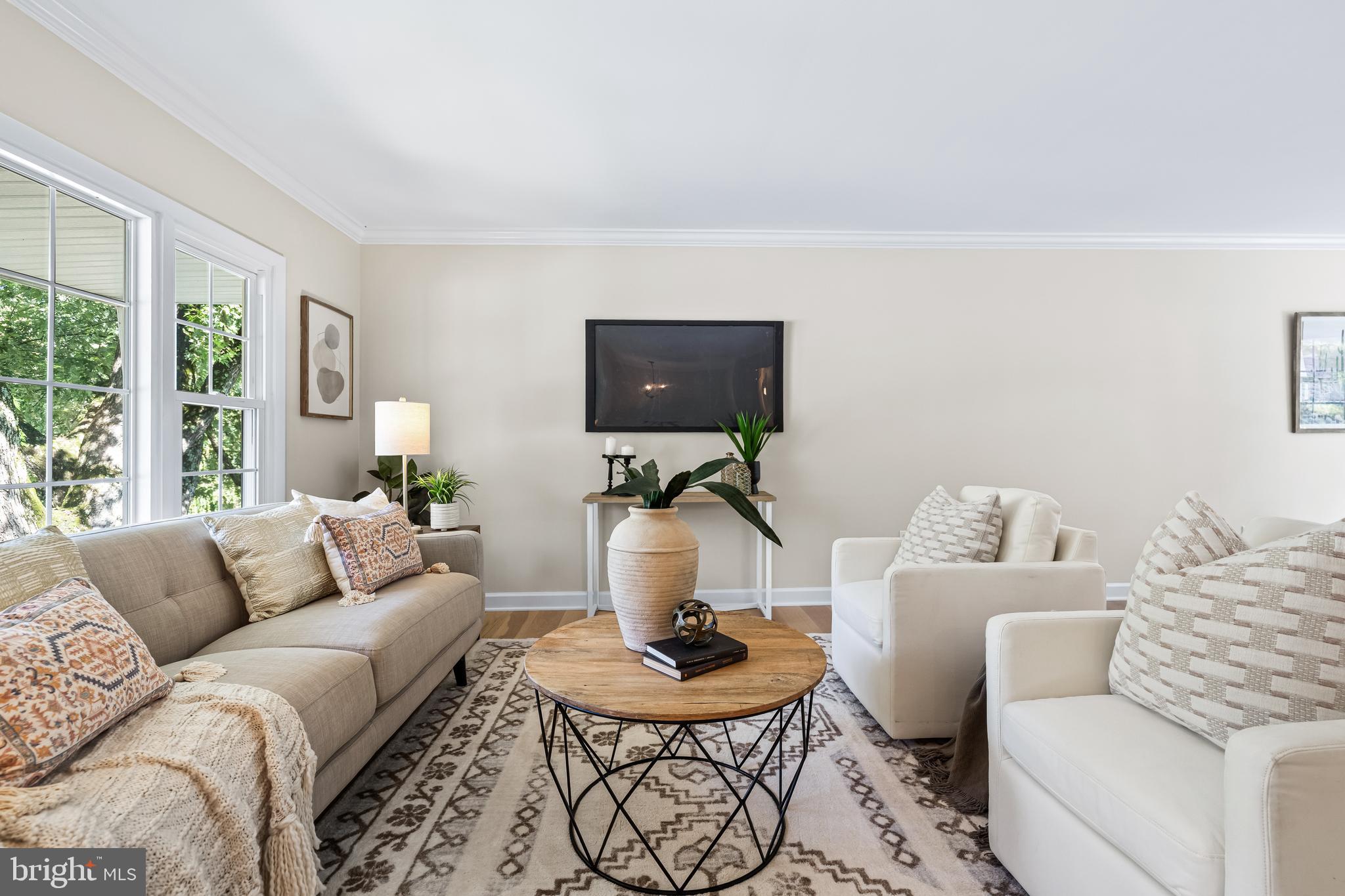 10845 Sandringham Road Cockeysville, MD 21030 - Photo 7 of 47 a living room with furniture a flat screen tv and a large window