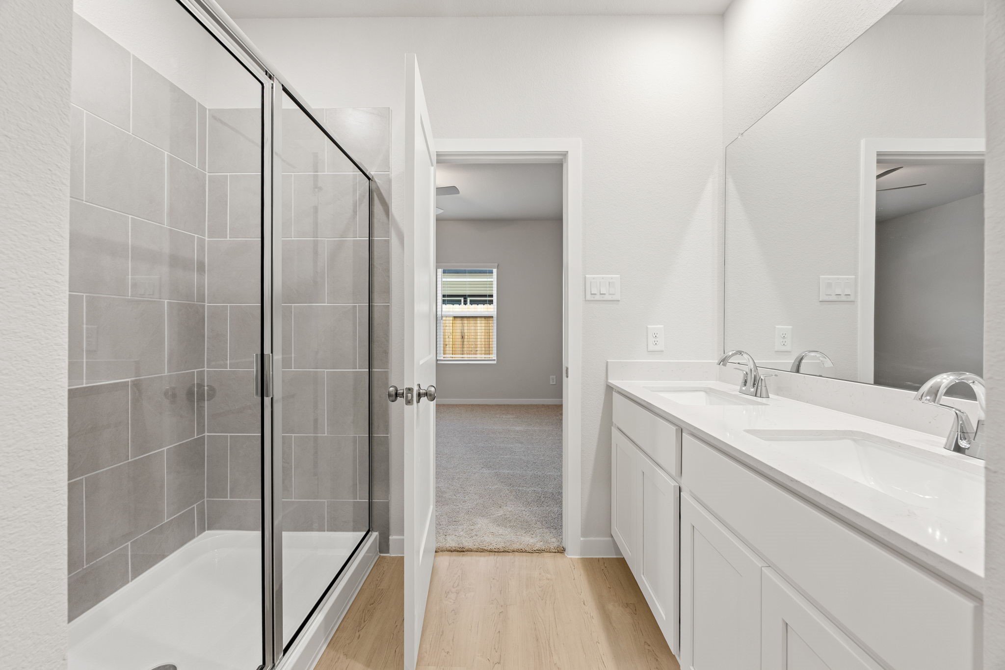 302 Brazen Forest Trail Magnolia, TX 77354 - Photo 12 of 22 a bathroom with a double vanity sink and mirror