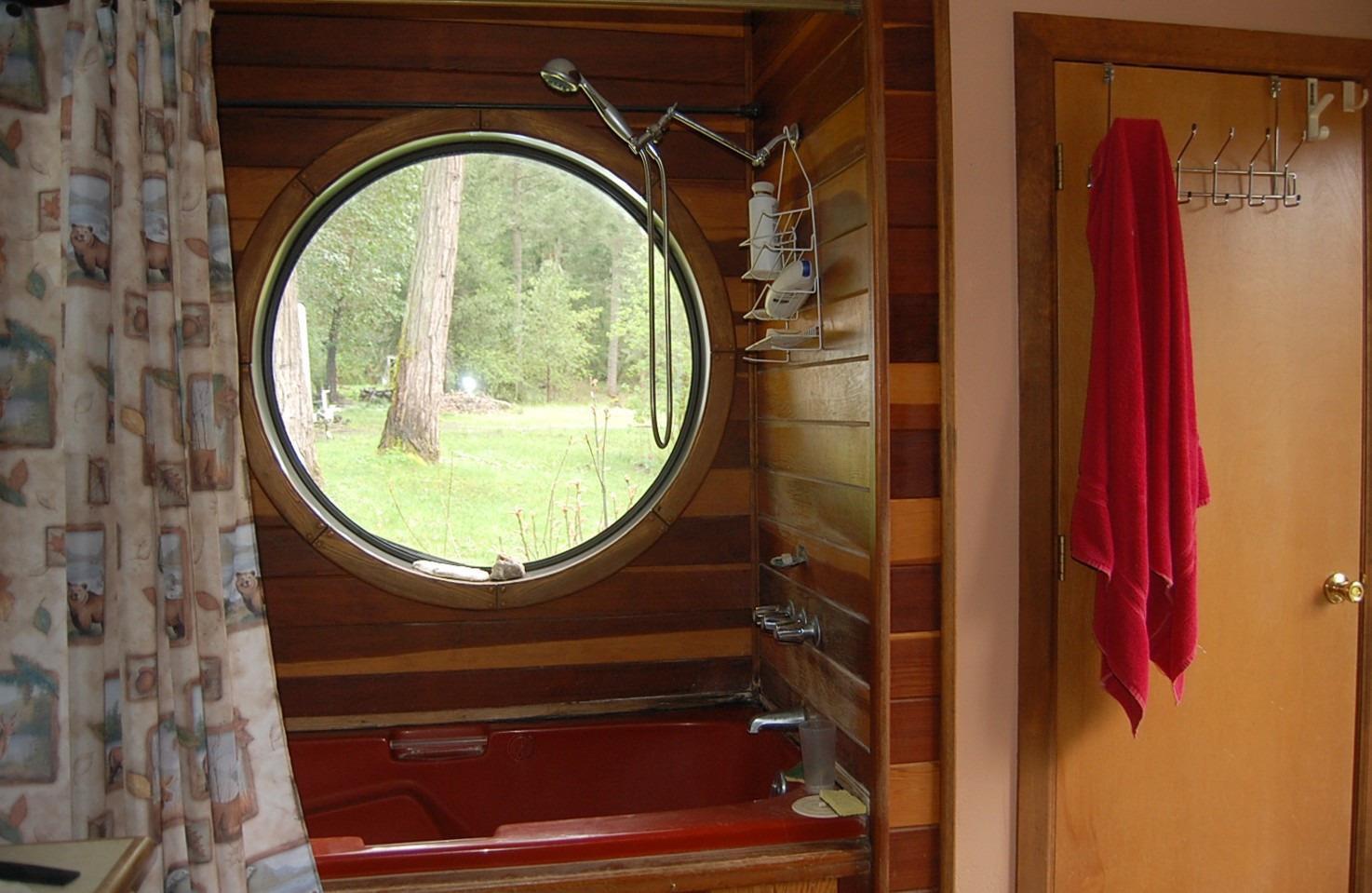 310 Page Creek Road Cave Junction, OR 97523 - Photo 17 of 31 Round Window in shower