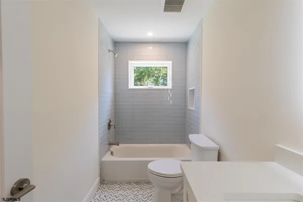 a bathroom with a bathtub toilet and sink