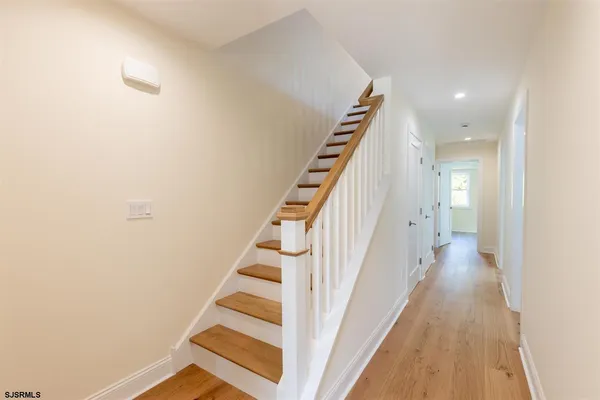 a view of a hallway with stairs