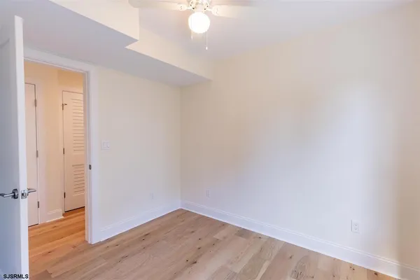 a view of a small space with wooden floor
