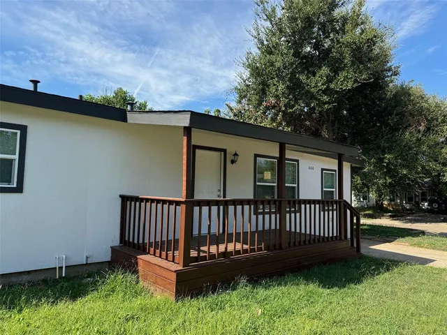 a view of a deck with a yard