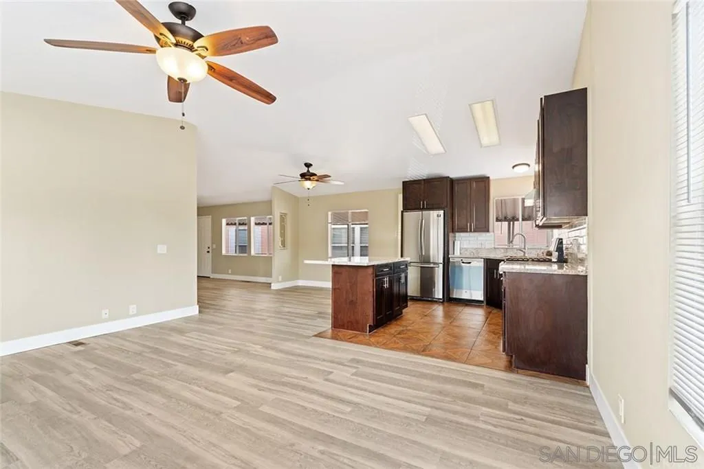 1638 Calavo Road, Unit 39 Fallbrook, CA 92028 - Photo 3 of 9 a living room with furniture and a wooden floor