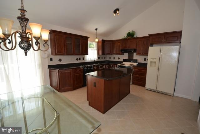 12 Mist Flower Road Ocean Pines, MD 21811 - Photo 16 of 42 a kitchen with stainless steel appliances granite countertop a stove a sink dishwasher a refrigerator and a oven
