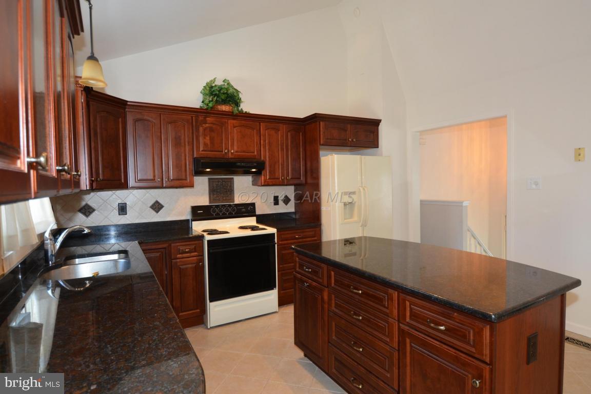 12 Mist Flower Road Ocean Pines, MD 21811 - Photo 20 of 42 a kitchen with granite countertop a sink stove and refrigerator