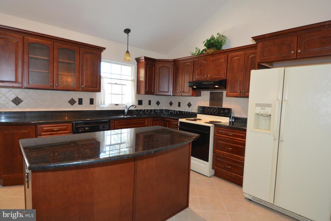12 Mist Flower Road Ocean Pines, MD 21811 - Photo 21 of 42 a kitchen with granite countertop a refrigerator stove and sink