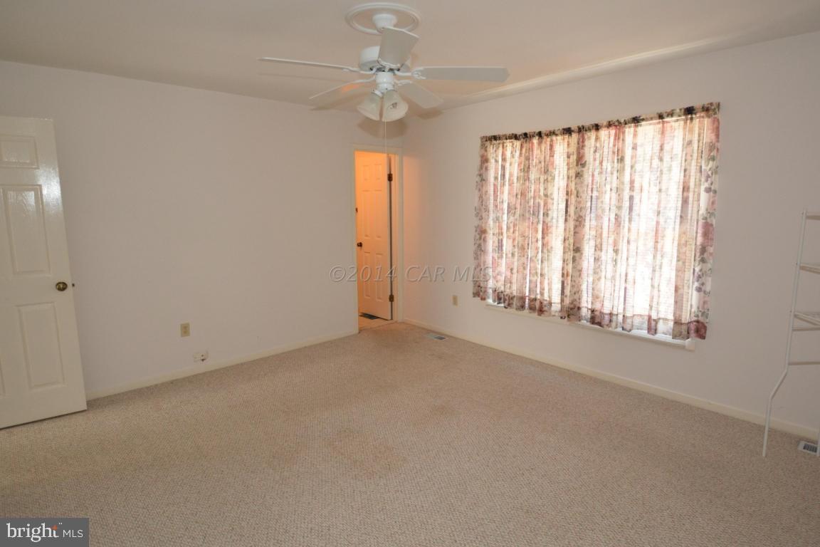 12 Mist Flower Road Ocean Pines, MD 21811 - Photo 23 of 42 an empty room with windows and fan