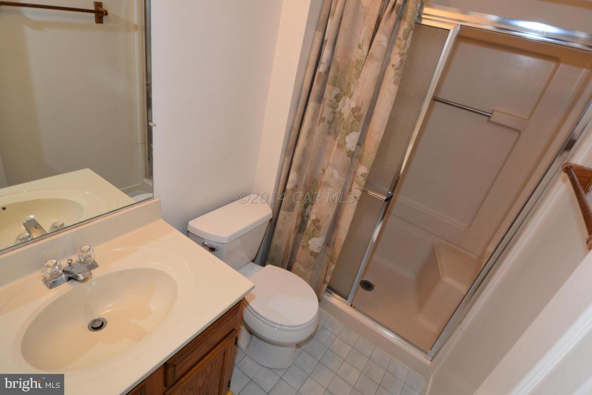 12 Mist Flower Road Ocean Pines, MD 21811 - Photo 24 of 42 a bathroom with a sink a toilet and shower