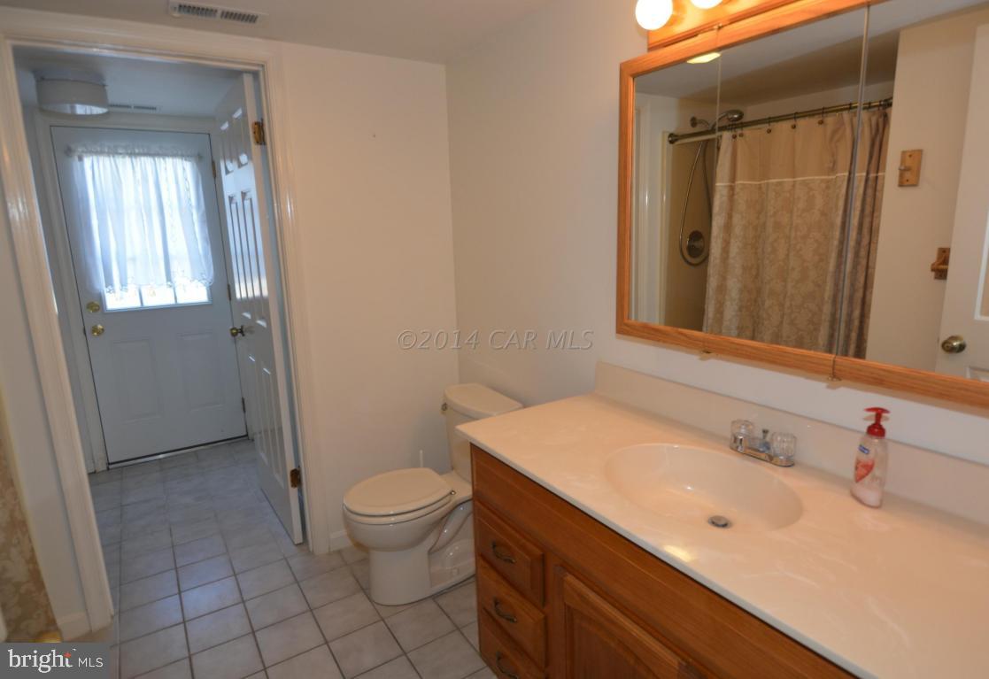 12 Mist Flower Road Ocean Pines, MD 21811 - Photo 9 of 42 a bathroom with a sink a toilet and shower