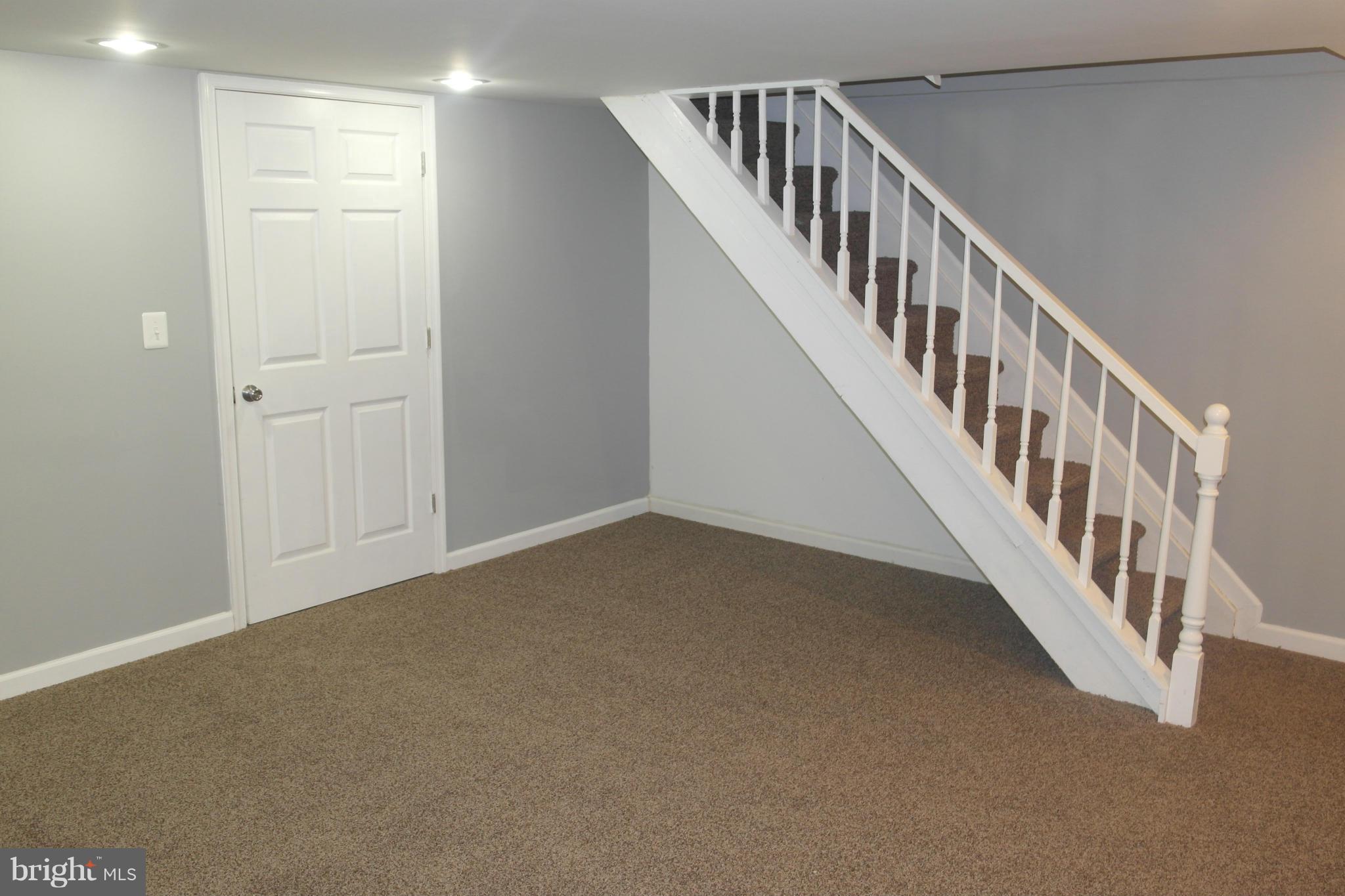 1225 Wicklow Road Baltimore, MD 21229 - Photo 15 of 17 a view of an entryway with wooden floor
