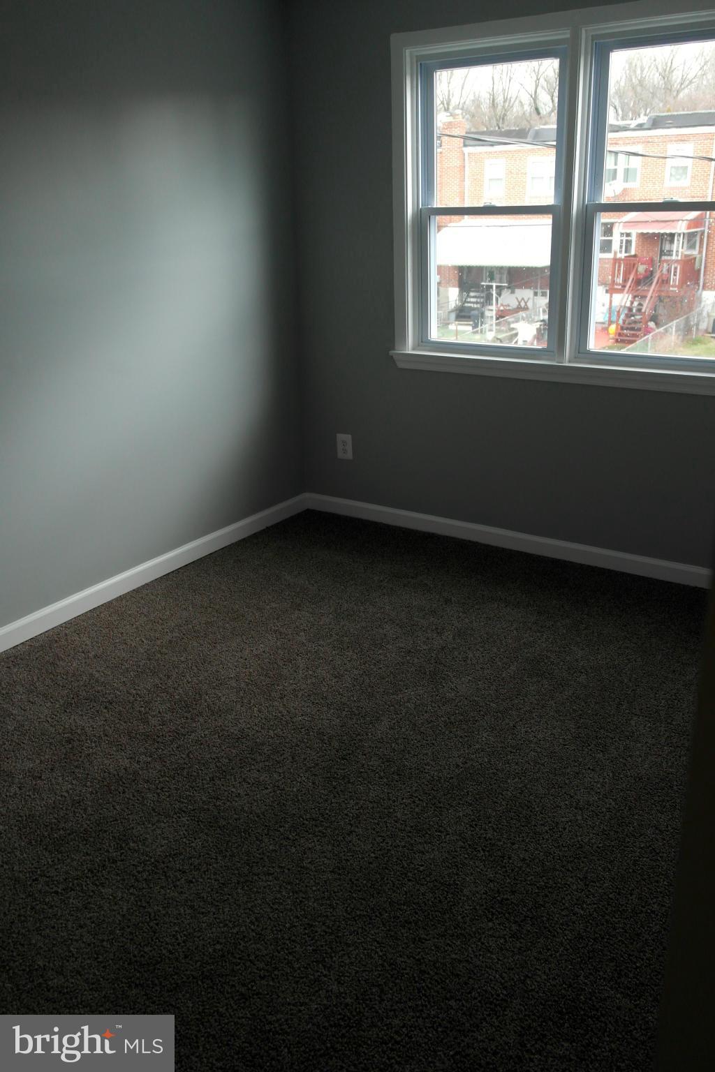 1225 Wicklow Road Baltimore, MD 21229 - Photo 10 of 17 a view of an empty room with a window