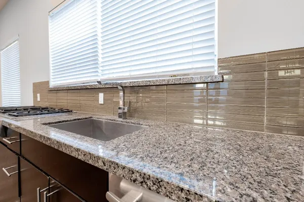 a kitchen with a sink and a window